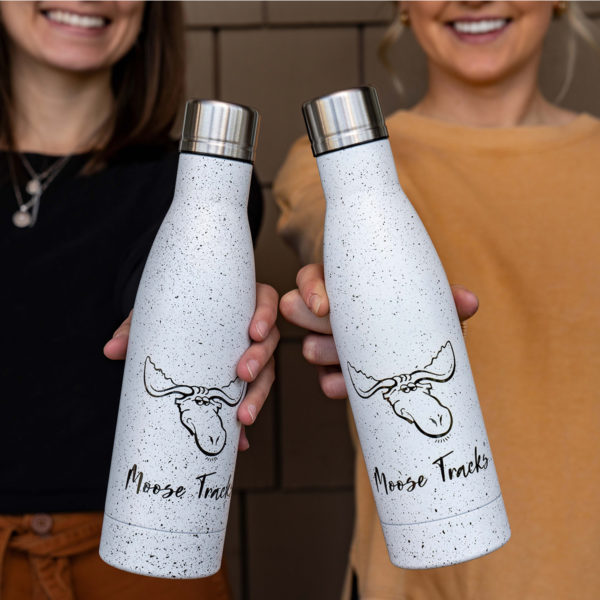 two people holding moose tracks water bottles