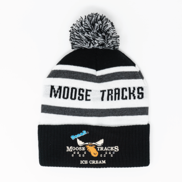 black, white, and grey winter beanie that reads moose tracks with moose tracks logo embroidered on black cuff
