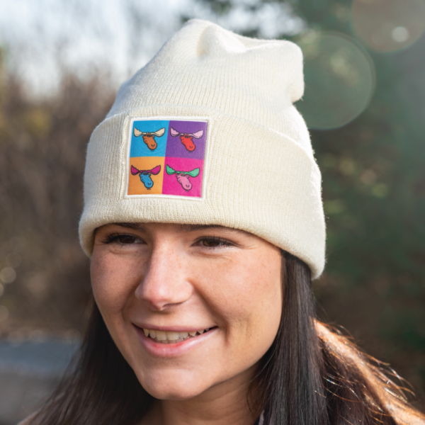 close up of model wearing beanie to show off the moose tracks patch