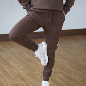 Brown sweatpants with a moose icon and "Moose Tracks" written in vanilla-colored screen printing